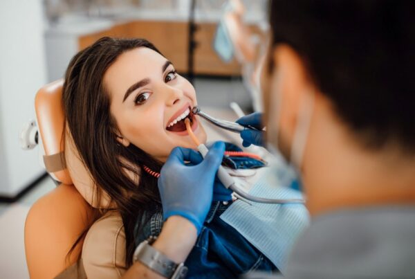 A woman at the dentist before undergoing full-mouth rehabilitation